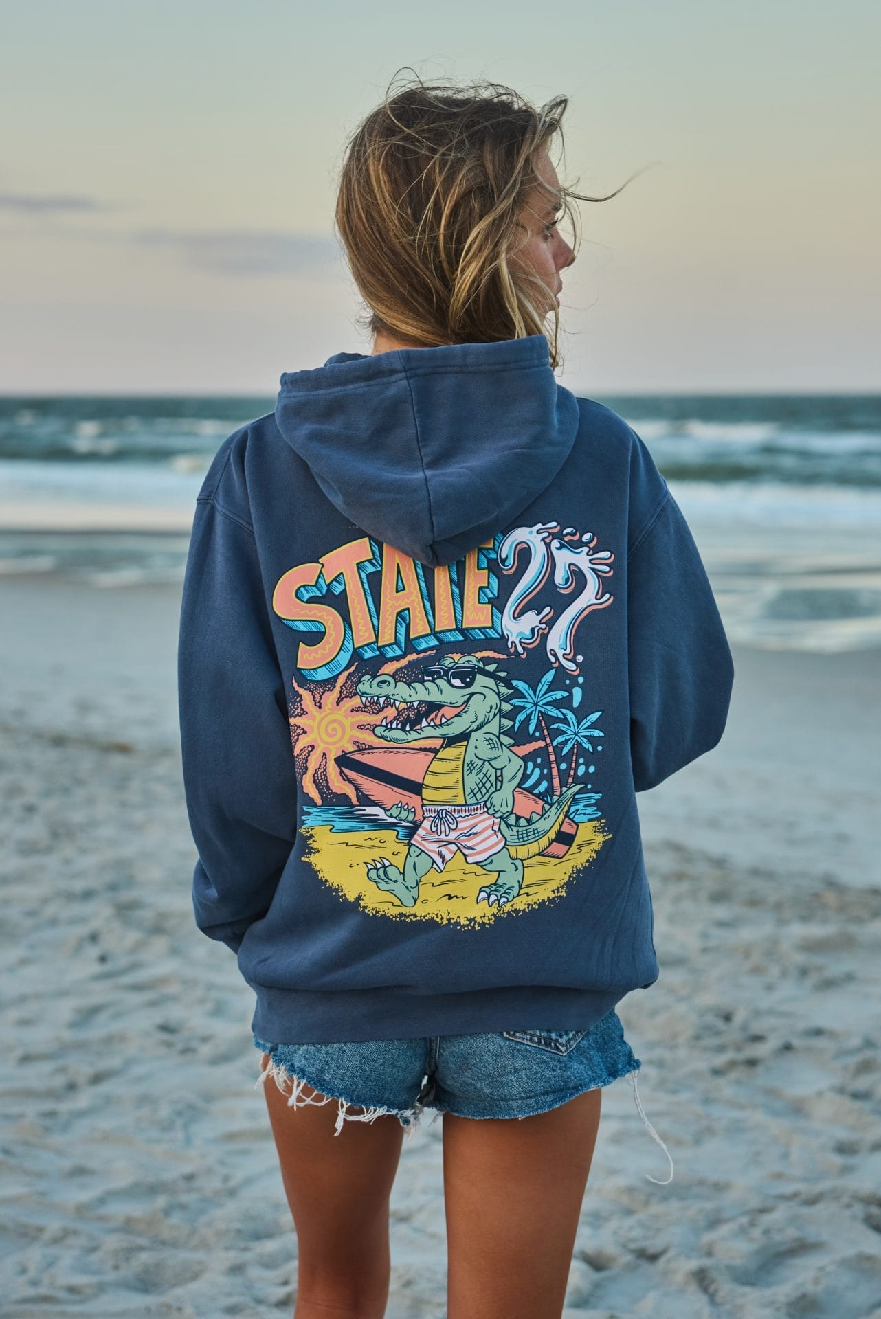 alligator-with-surfboard-hood-girl-back