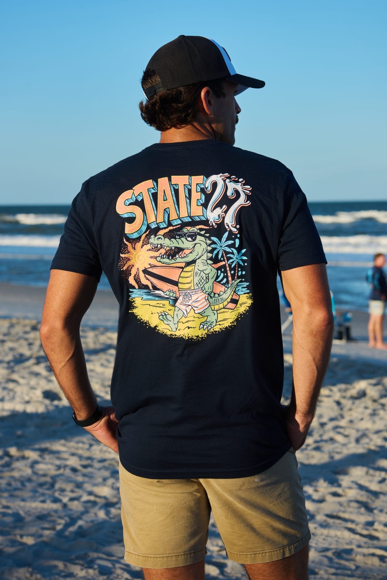alligator-with-surfboard-male-back
